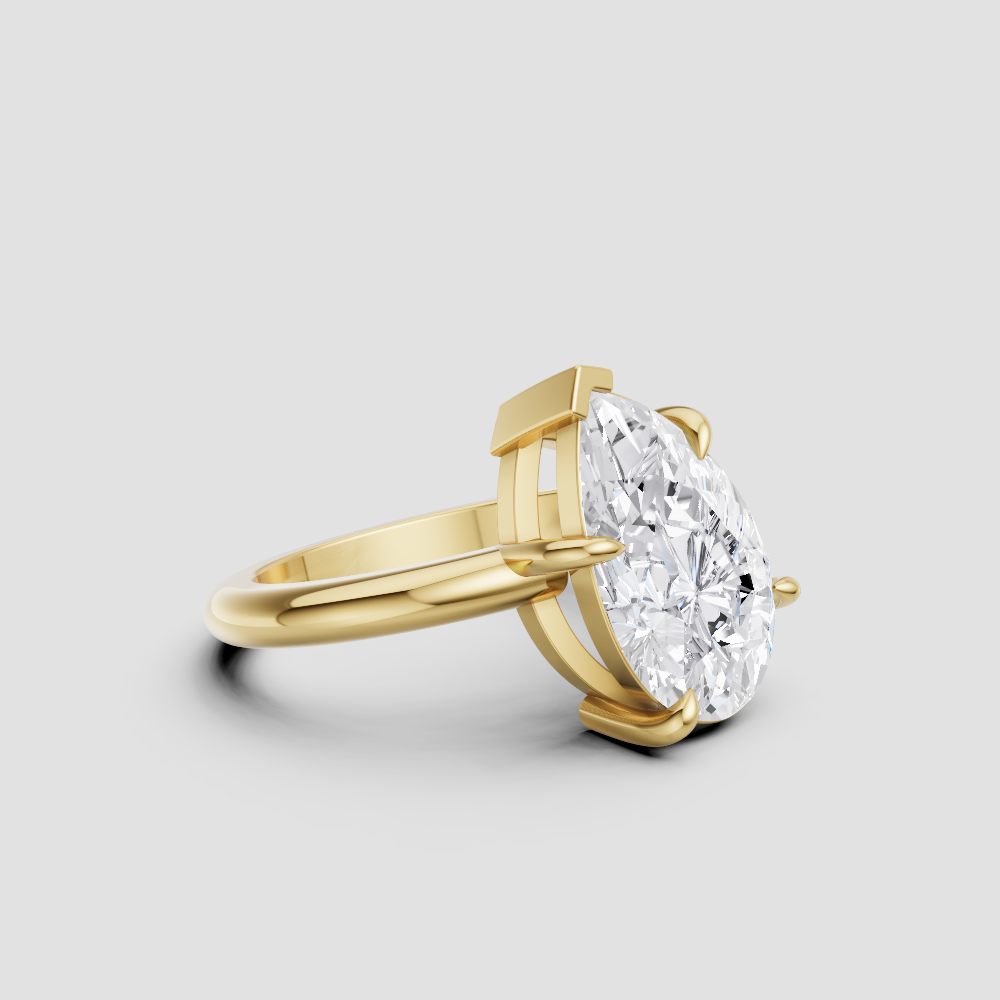 Modern Pear-Cut Diamond Solitaire Engagement Ring – 14k Yellow Gold with V-Prong